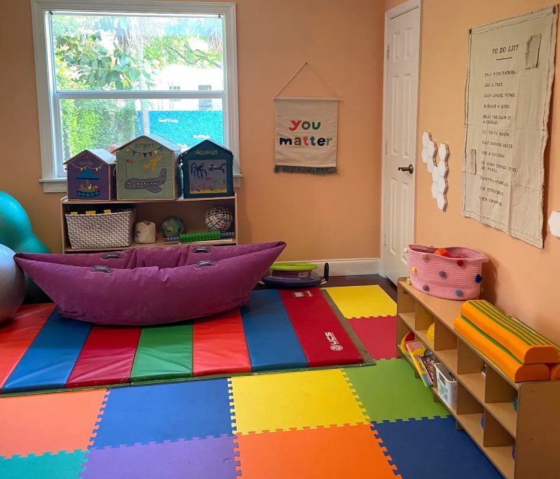 A room with many colorful mats and toys.