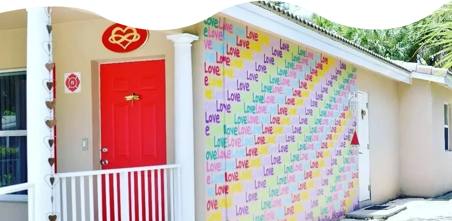 A wall with many different colored words written on it.